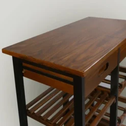 28" Solid Wood Rolling Kitchen Cart With Wine Rack And Drawer Dark Brown - Flora Home 21 28" Solid Wood Rolling Kitchen Cart With Wine Rack And Drawer Dark Brown - Flora Home -Furniture Specialty Store GUEST a9346ccf 4dd2 4077 8c83 2c9a207ed755